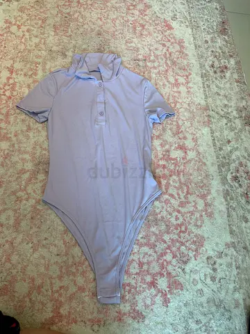 Light purple short-sleeve womens bodysuit, size medium