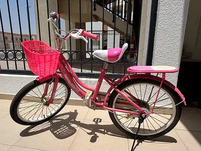 Pink kids bicycle with front basket - excellent condition - suitable for kids 6-9 yrs age