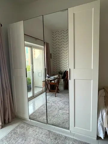 Custom built  4-door white mirrored wardrobe with shelves and drawers in good condition