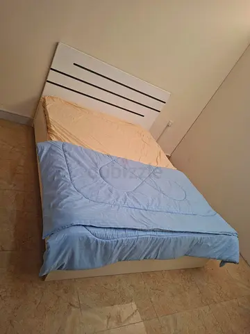 White double bed frame with mattress and bedding - simple modern design