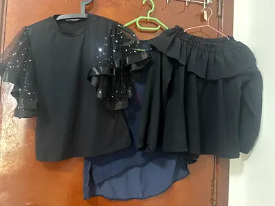 Set of three womens tops including black sequin sleeve and off-shoulder styles