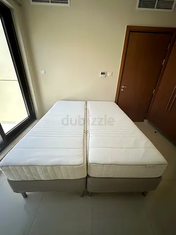 Two single mattresses with bases - transforming into 1 queen bed- Excellent condition