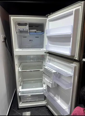 Clean Double-Door Refrigerator with Freezer (Good Working Condition)