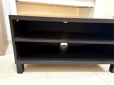 Low black TV stand / media console with shelves