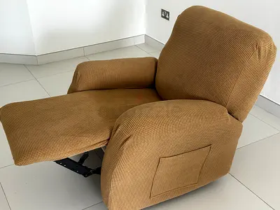 Comfortable brown fabric recliner chair with footrest