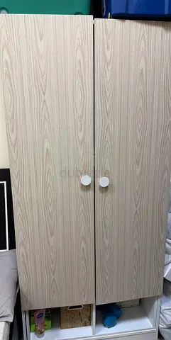 Light wood 2-door wardrobe / storage cabinet - good condition