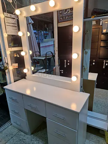 We are selling used  Dressing table with merior and smoked light