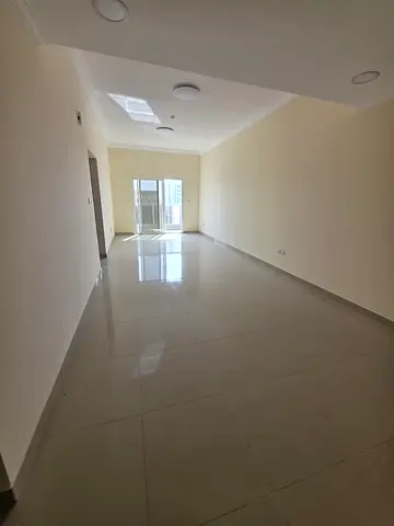 **One-bedroom apartment and living room, first tenant, 2 bathrooms, deluxe finishing in Al Jurf 3, very spacious, with built-in wardrobes.**