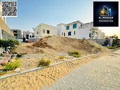 Prime residential land for sale in Al Alia area – Ajman. Strategic location on an asphalt road. La