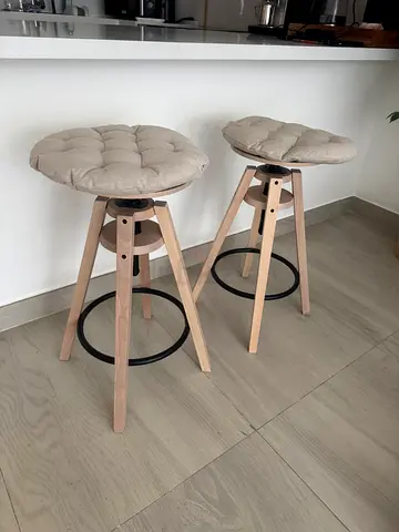 Pair of modern round wooden stools with cushions