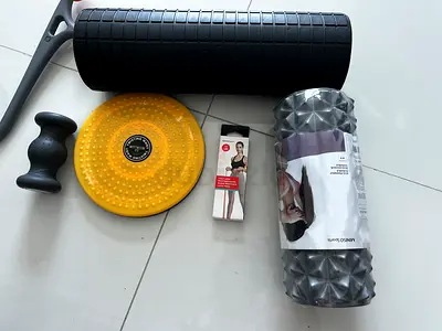 Set of foam rollers, balance disc and massage tools - light used
