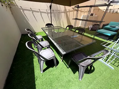 Outdoor Glass-Top Dining Table with 7 Chairs — Used, Good Condition