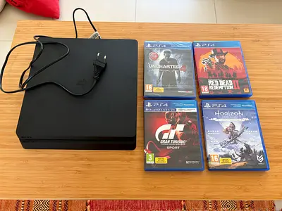 PlayStation 4 Slim 500GB with 4 Games - Horizon, Uncharted, Red Dead Redemption 2, Gran Turismo