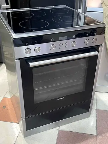Siemens iQ300 freestanding ceramic cooker in stainless steel.It features 4 electric cooking zones an