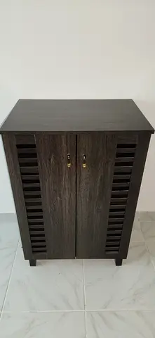 Dark Wood Cabinet with Slatted Doors