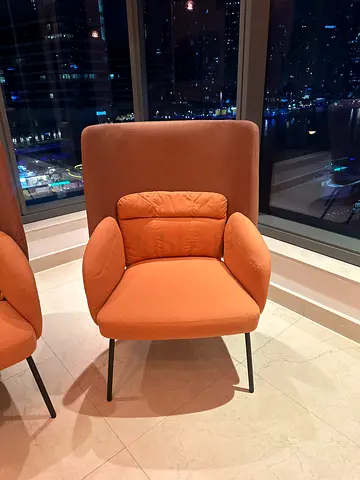 Modern orange upholstered lounge chairs - barely used