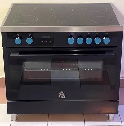 La Germania TUS9CER61LBX electric ceramic cooking range with five hobs and a stainless steel finish.