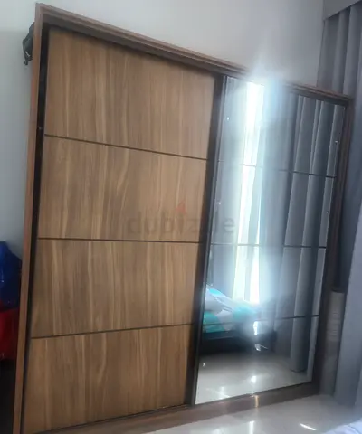Brown king bed 70×170 cm with a brown closet with a mirror on the closet
