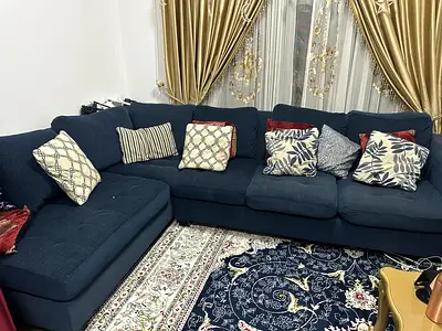 Dark blue L-shaped fabric sofa with chaise - good condition