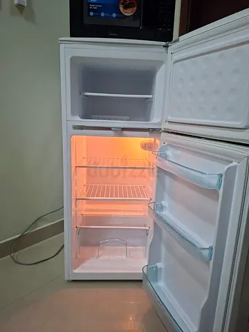 Compact double-door refrigerator with freezer — good working condition