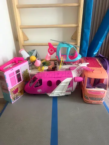 Bundle of kids Barbie dolls, foldable Barbie dollhouse, camper van, helicopter plane  accessories