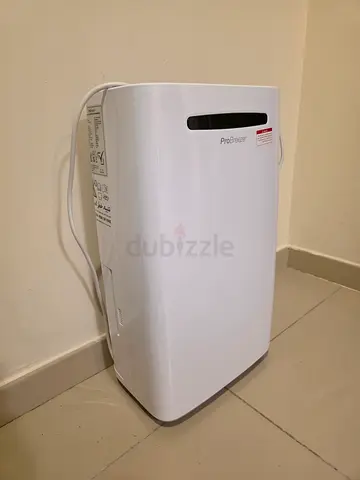 Portable dehumidifier - compact white unit, gently used