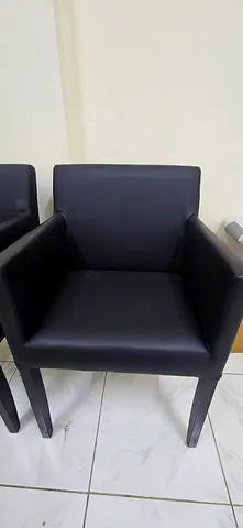 Pair of sleek black upholstered armchairs
