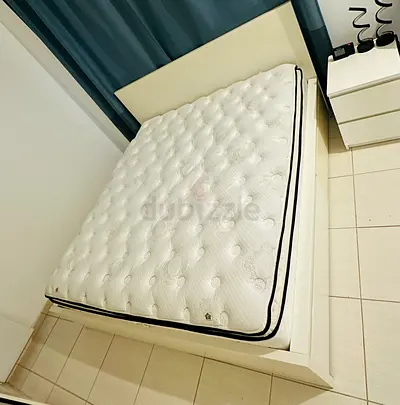 King-size bed frame with mattress — light wood, good condition