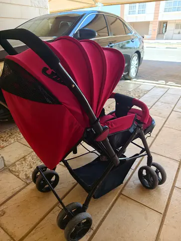 Lightweight red baby stroller - good condition