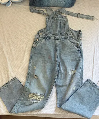 Light blue distressed denim overalls