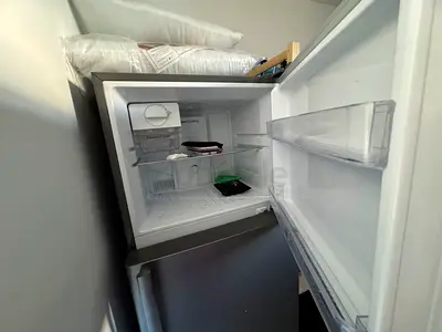 Small single-door refrigerator with freezer compartment - used