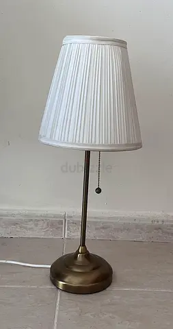 Classic brass table lamp with white pleated shade