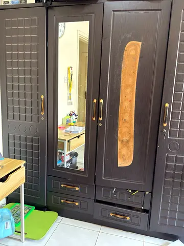 Dark wooden 4-door wardrobe