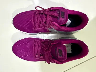 Used Nike womens running shoes - purple, size label inside