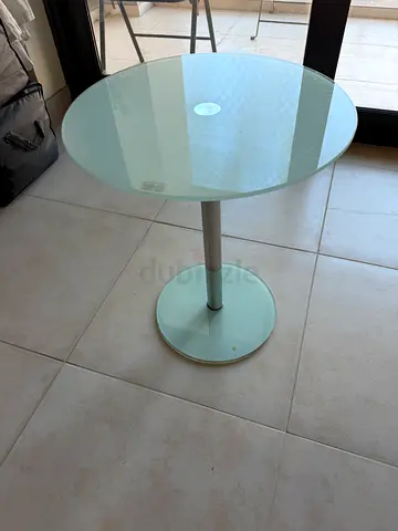Round glass side table with metal base