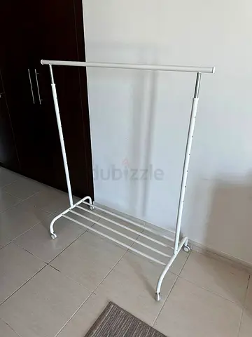 Adjustable White Clothing Rack with Bottom Shelf (Good Condition)