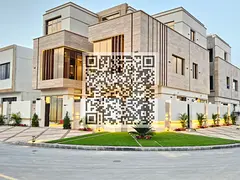 Luxurious three-story corner villa in Al Yasmeen behind Al Hamidiya Park, featuring 7 master bedroo