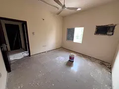 Lowest prices for rent in Al Muwaihat 3, two bedrooms, living room, and hall between the rooms, in a