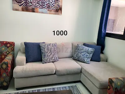 Light grey L-shaped sofa with chaise - good condition