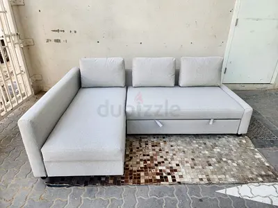 Light grey L-shaped sofa with storage - good condition