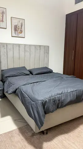 Queen upholstered bed with headboard in light grey - good condition