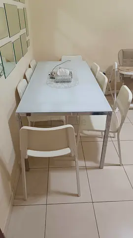 White Glass Dining Table with 6 Folding Chairs - Good Condition