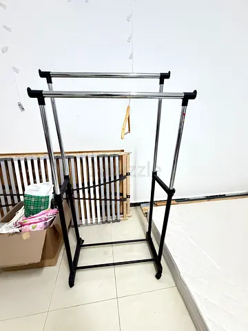 Double-Rail Freestanding Clothes Garment Rack on Wheels - Good Condition