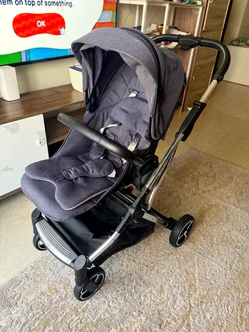 Compact grey stroller in good used condition
