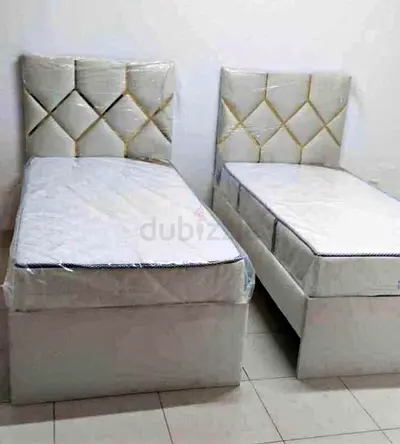 Brand New Pair of single beds with headboards and mattresses