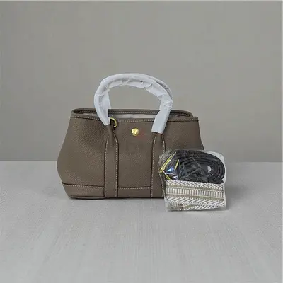 Chic Taupe Grained Leather Handbag with Detachable Straps