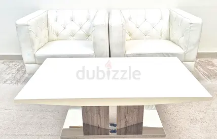 Pair of White Tufted Sofa Chairs And Coffee Table