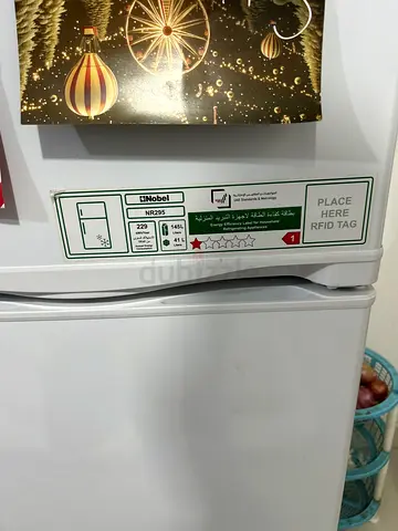 Compact double-door refrigerator in best working condition, with minimum usage.
