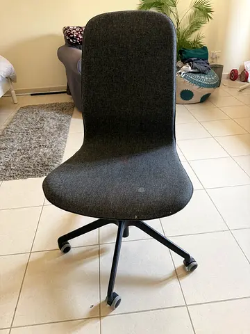 Grey upholstered office/task chair on wheels - good condition