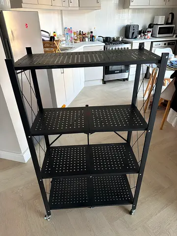 Black metal island cart with 3 shelves and wheels